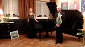 1242nd Liszt Evening - Parlour of Four Muses in Oborniki Slaskie, 17th March 2017. <br> Anna Lipiak and Juliusz Adamowski were given pictures by Jolanta Nitka <br> (on the walls exhibition of posters by Tomasz Pietrek (Academy of Fine Arts in Wroclaw). Photo by Jolanta Nitka.